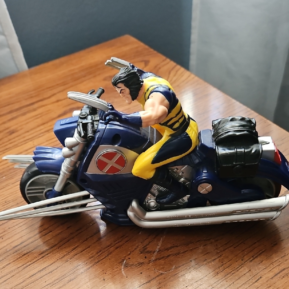 Vintage 2008 Blue and Yellow Wolverine Action Figure on Motorcycle